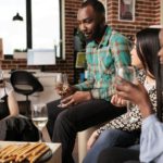 Different ethnicities women listening man conversation