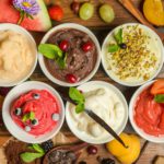 Top view of different flavors of ice cream in bowls