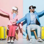 woman and smiling man in virtual reality headsets with outstretched hands on pink and blue
